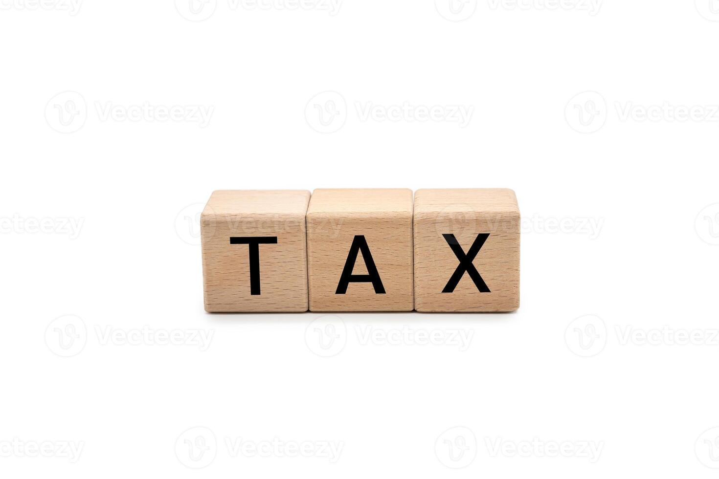 TAX Word with Wooden Blocks on White Background with clipping path. taxation, financial obligations, and accounting concepts, and is ideal for conveying topics related to business, finance. photo