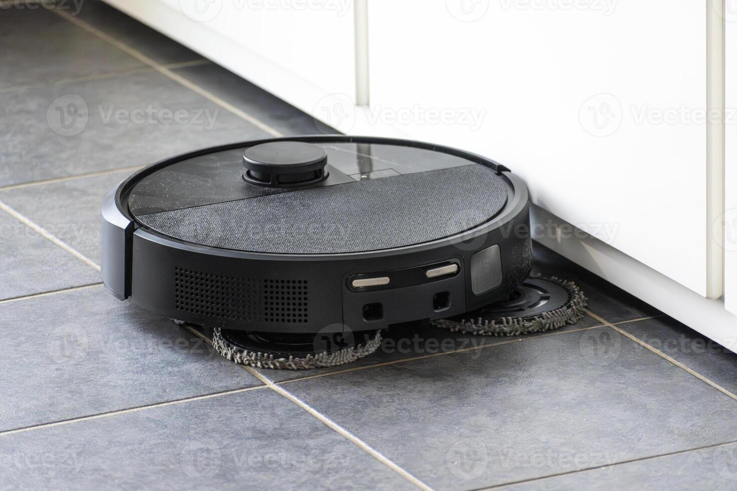 Robot vacuum cleaner with dust, real life photo, saves time and goes into hard-to-reach places, dusty photo