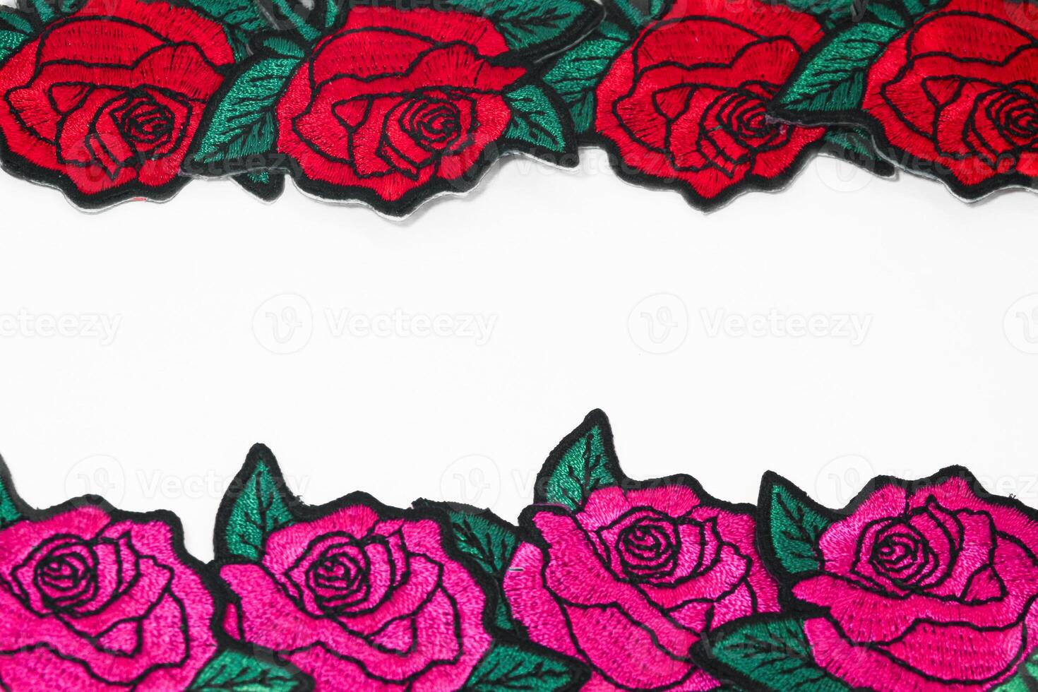 Embroidered pink and red roses on white background, arranged top and bottom with space for text in center. Romantic handmade design for wedding, love, and anniversary themes. photo