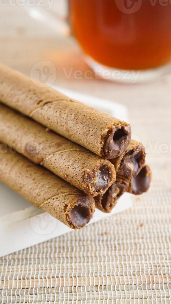 Stack of chocolate cookies on table photo