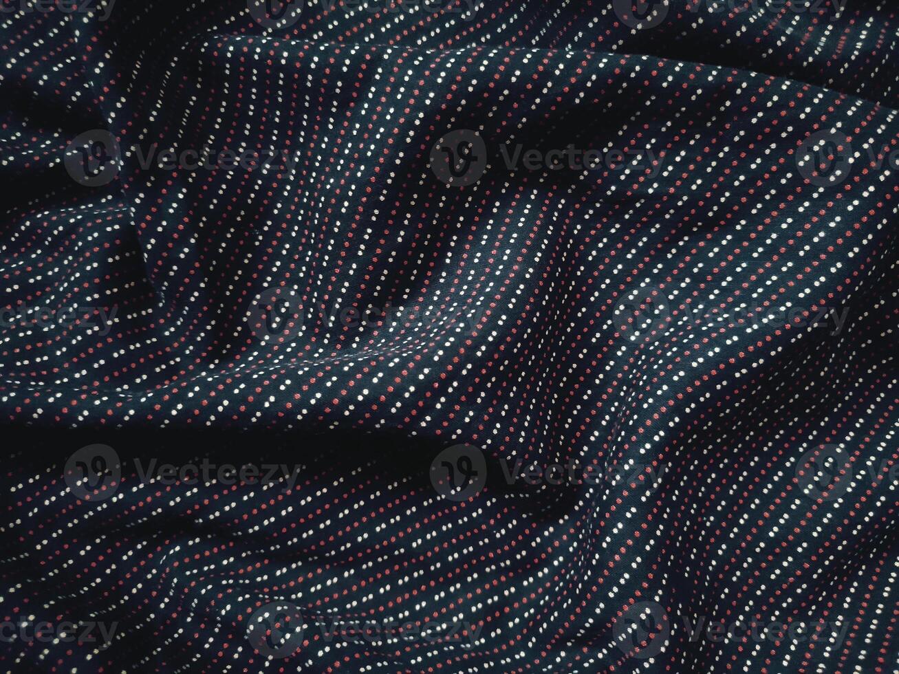 a close up of a black and blue striped fabric photo