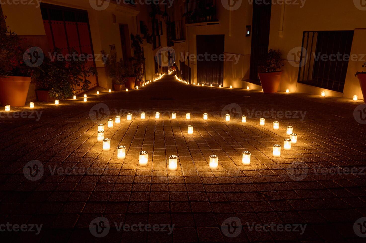 Enchanting Night Scene of Candlelit Pathway in Village Street photo