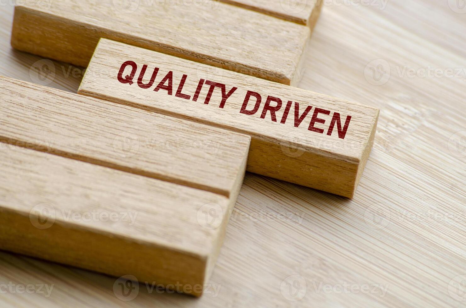 Quality Driven text on wooden blocks. Business and Quality control concept photo