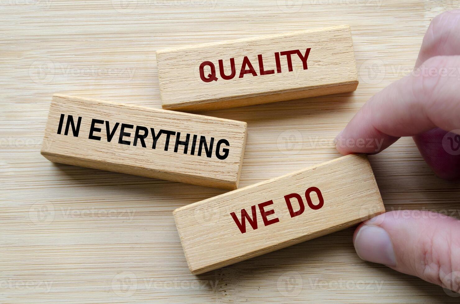 Quality in everything we do message on wooden blocks highlights a commitment to delivering consistent excellence photo