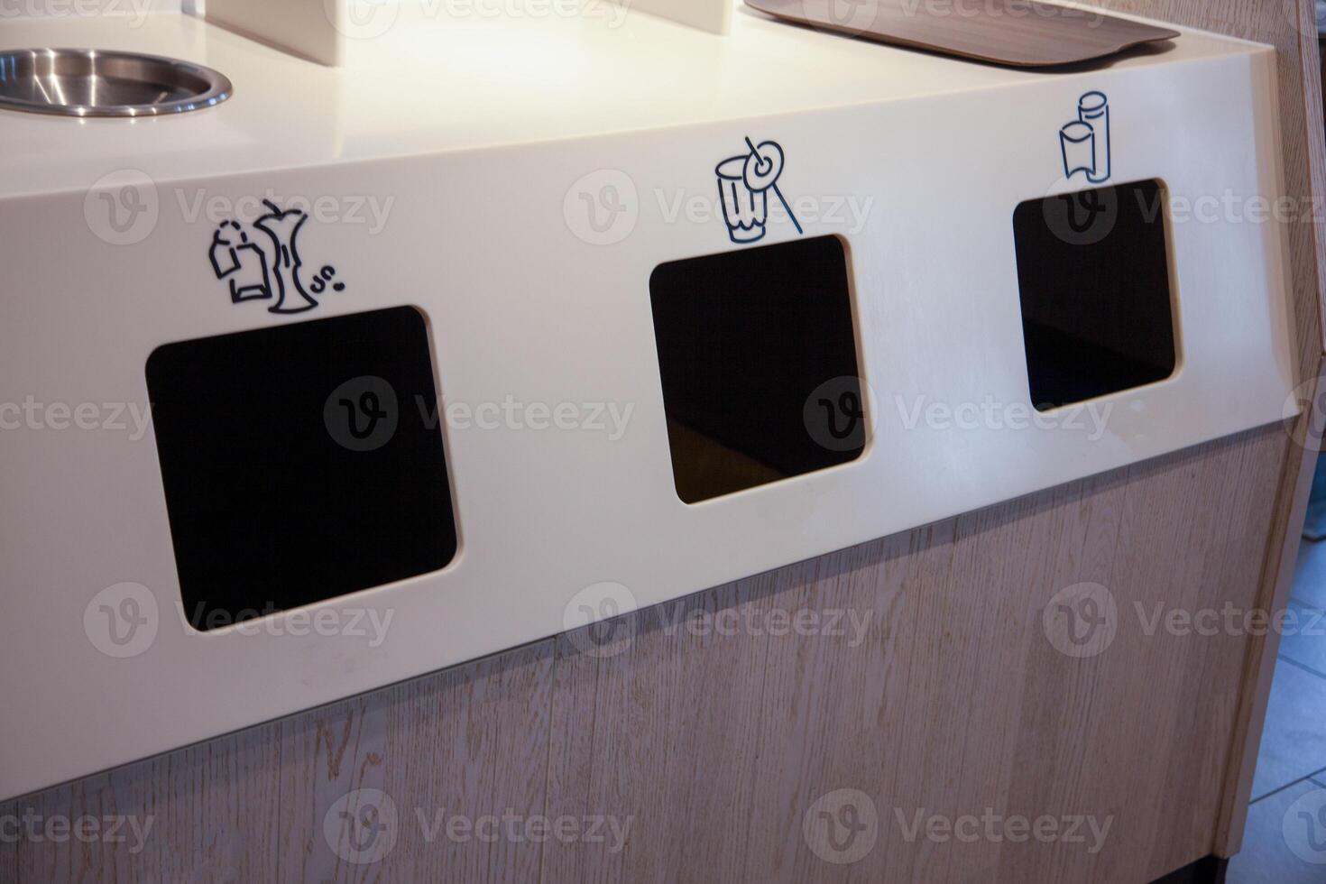 Indoor Trash and Recycling Station. Garbage sorting. Plastic garbage containers. Recycle waste Bins photo