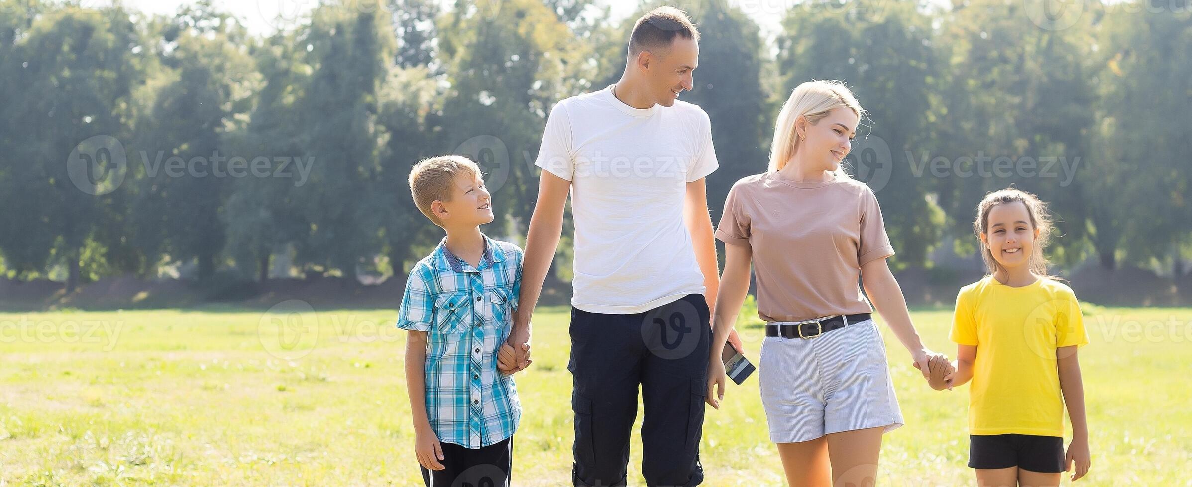 Family, happy outdoor with love for bonding, weekend fun and games in nature with sunshine. Parents, kids and carry on back for summer activity, forest scenery or smile on morning walk photo