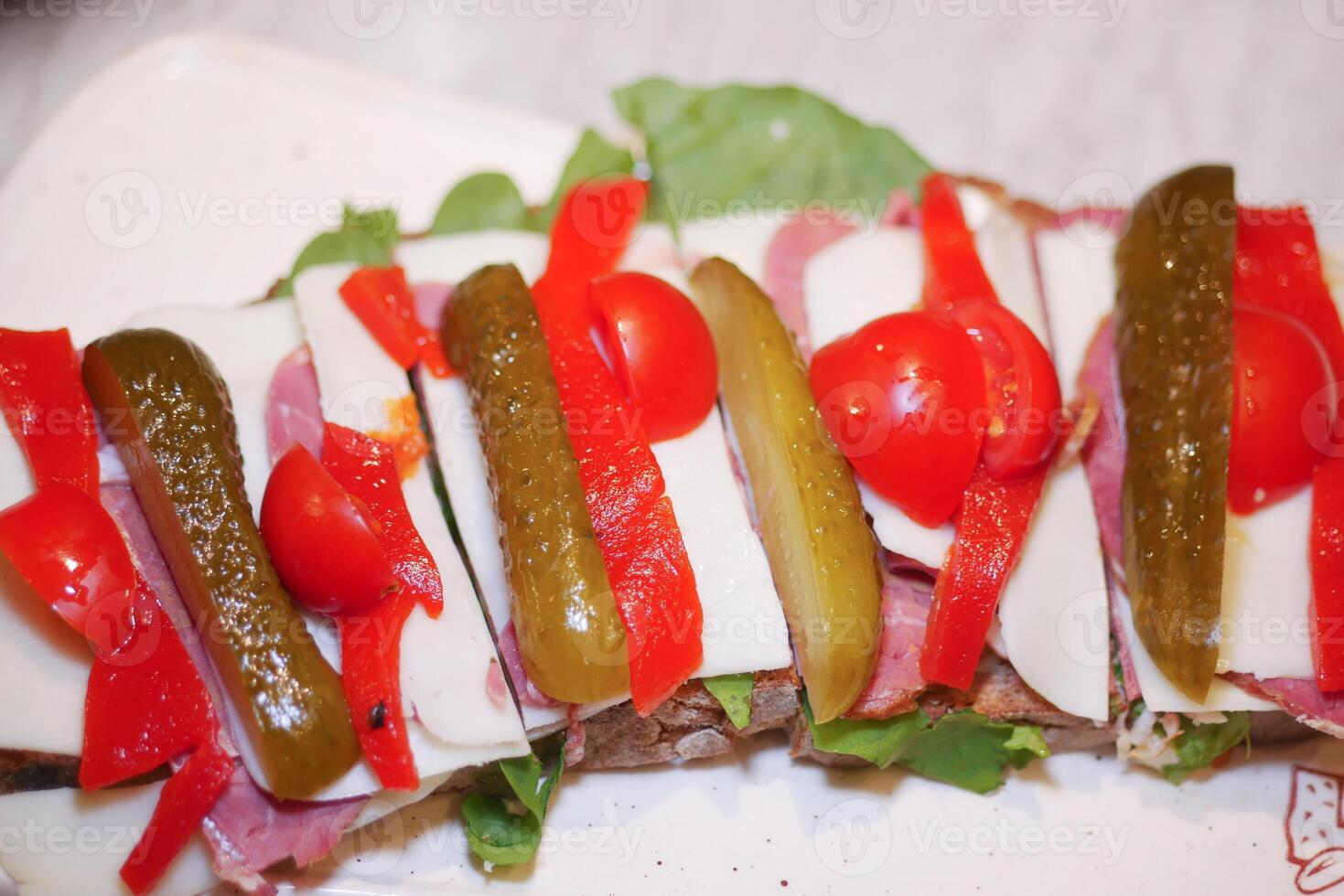 Colorful Open-Faced Sandwich with Vegetables and Cheese on Wholegrain Bread photo