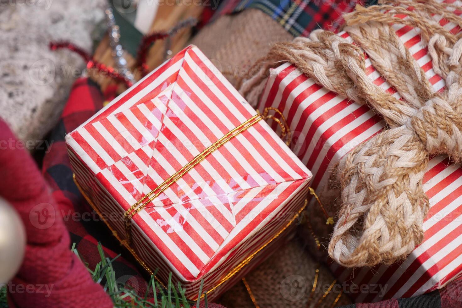 Holiday gifts wrapped in festive paper and twine photo