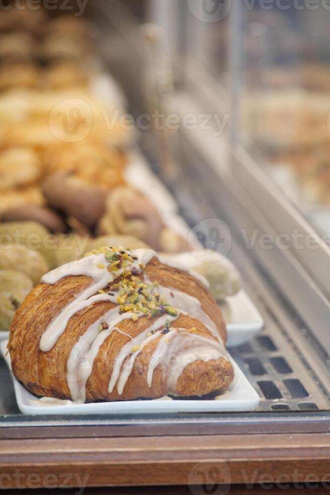 Delicious pastry display at a bakery in the afternoon photo