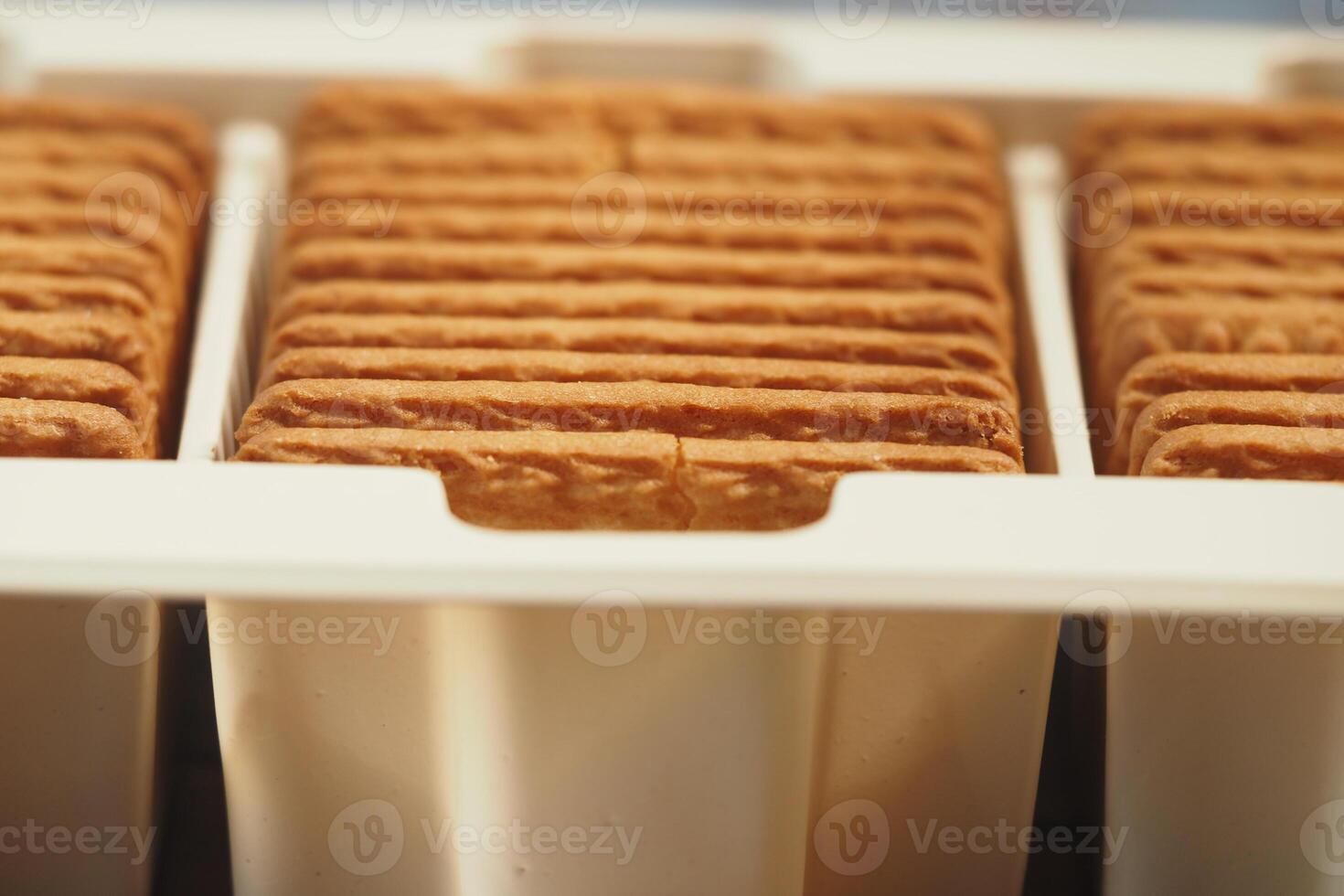 Biscuit stacks ready for packaging in factory setting photo