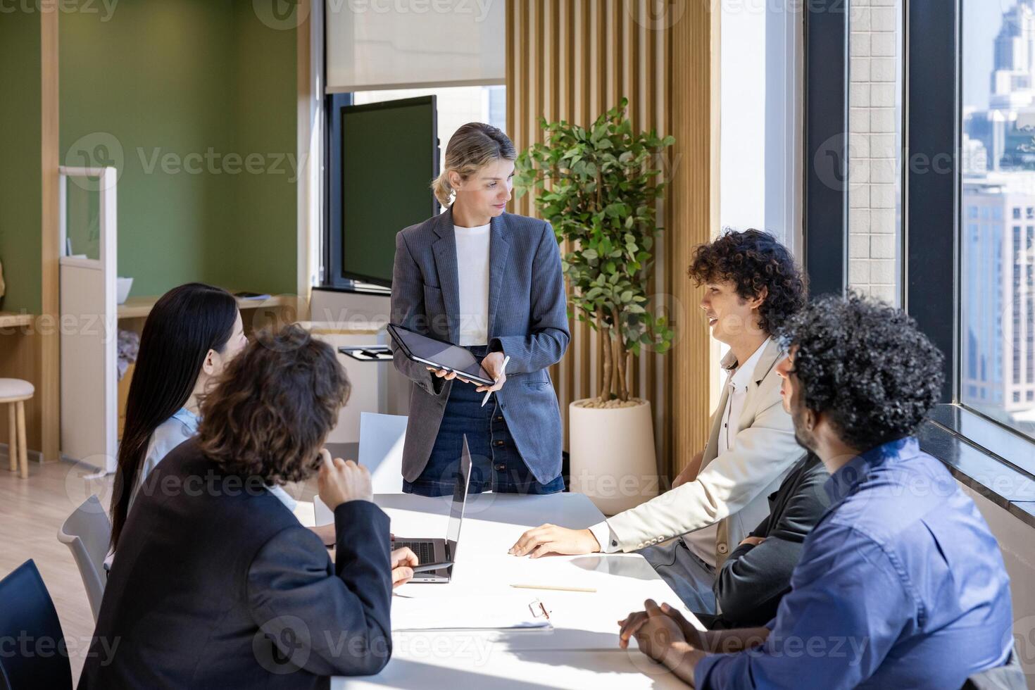 Caucasian woman manager is showing annual report chart to her colleagues in executive meeting for next year plan with market share increase for global business and investment photo