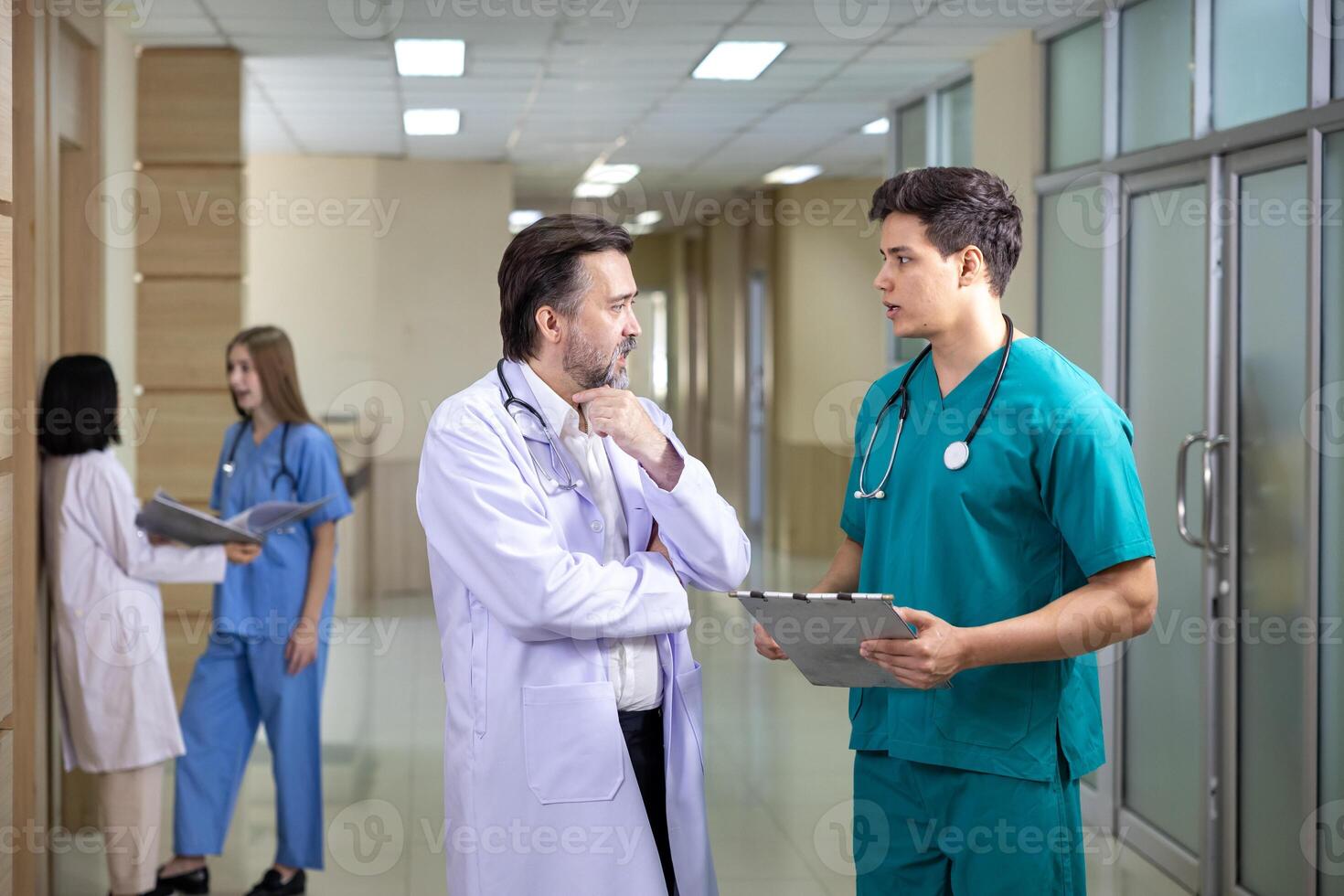 Team of diversity nurse and doctor is discussing and brainstorming on patient medical record after diagnosis for precise care plan with experience senior physician specialist photo