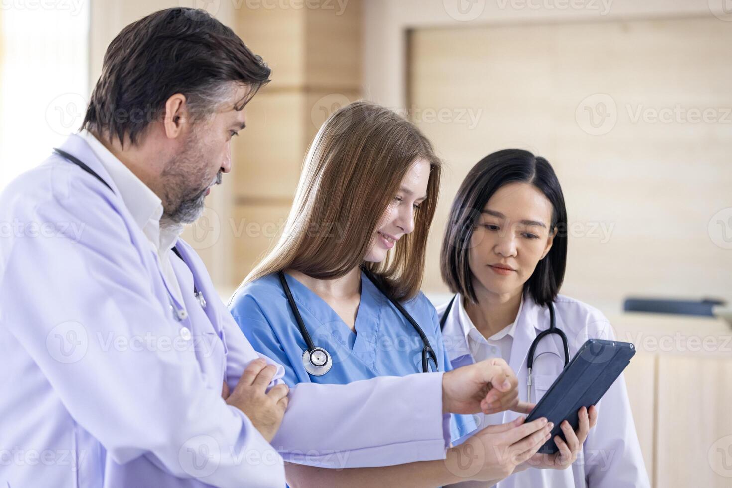 Team of doctor and nurse is discussing and brainstorming over patient medical record after diagnosis for precise care plan with experienced senior physician specialists photo