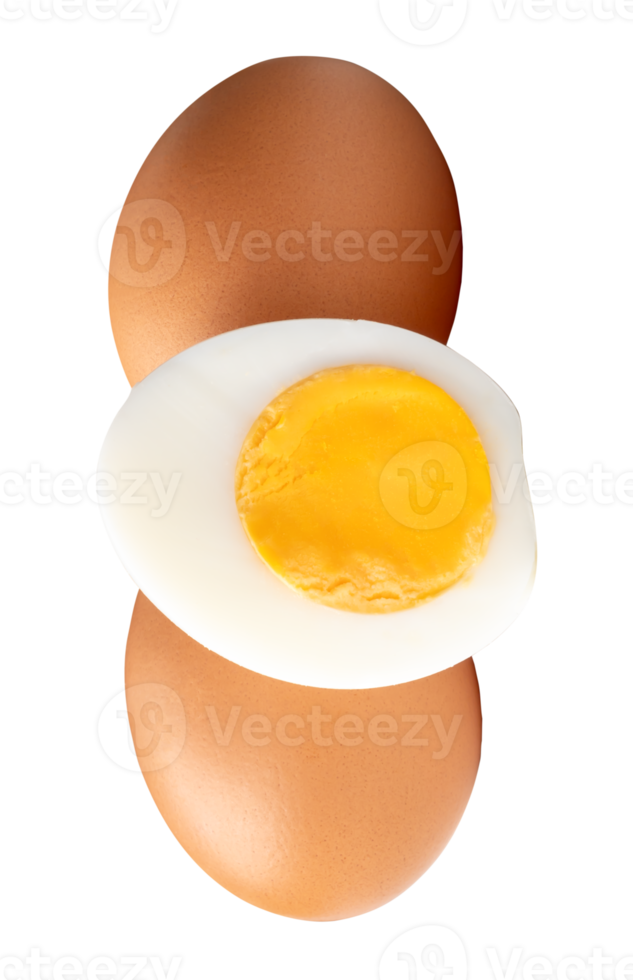 Raw chicken eggs and cooked or boiled chicken egg with egg yolk in half in vertical stack isolated with clipping path in file format png