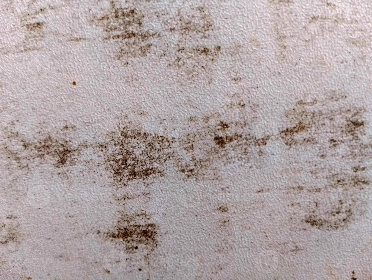 Close-up of surface with dark spots and textures photo