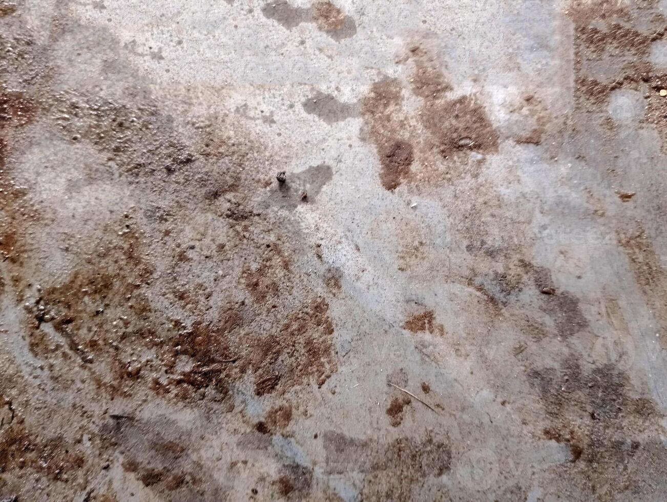 Concrete surface with stains and textures, ideal for construction or industrial themes. photo