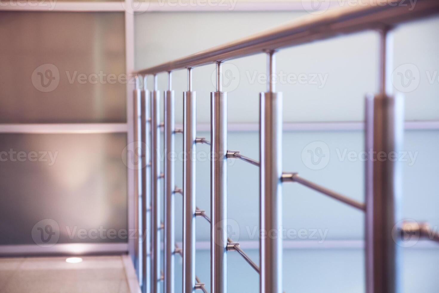 Metal hand rails in a modern building. Building interior. Selective focus. photo