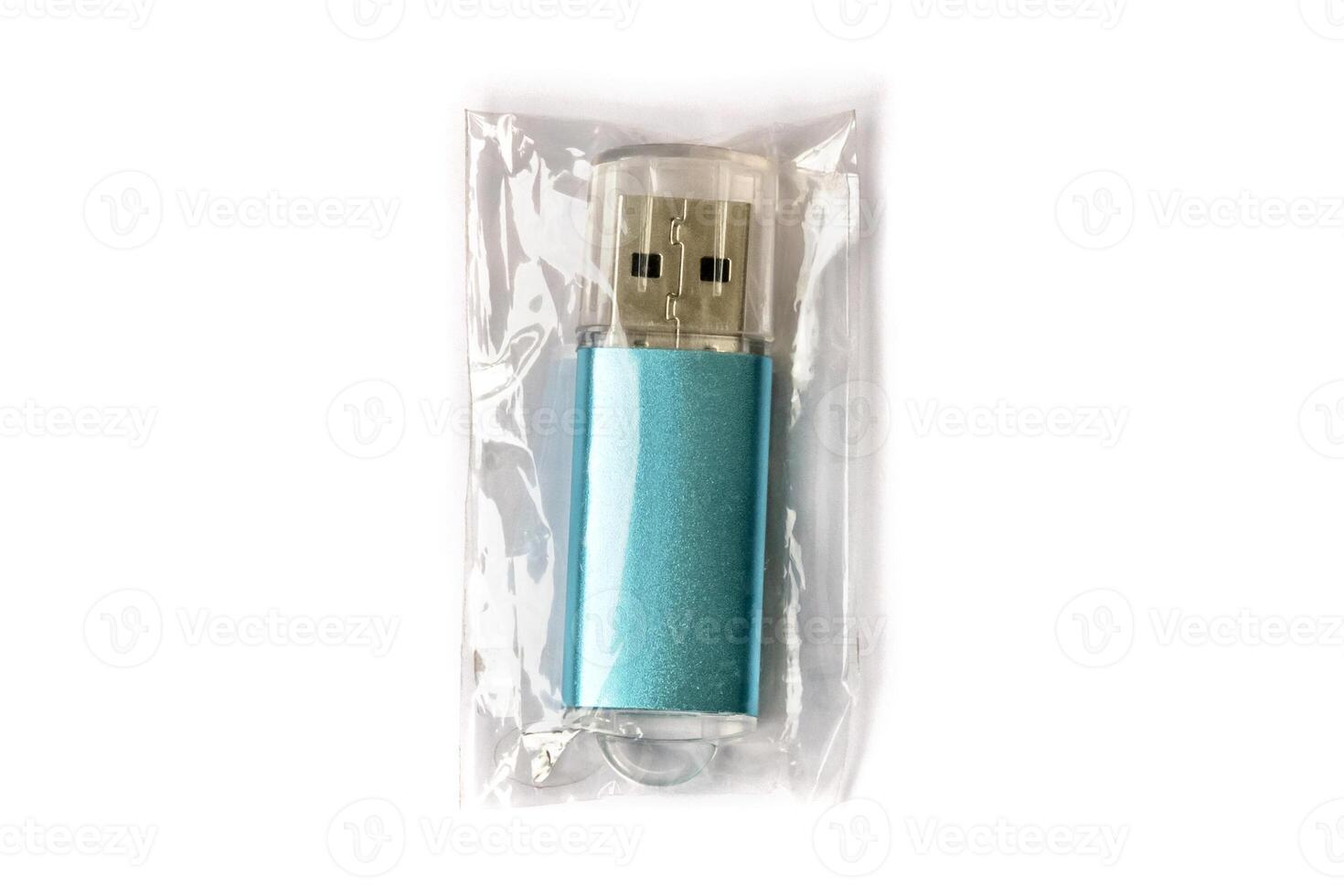 USB flash drive in transparent packaging isolated on white background. photo