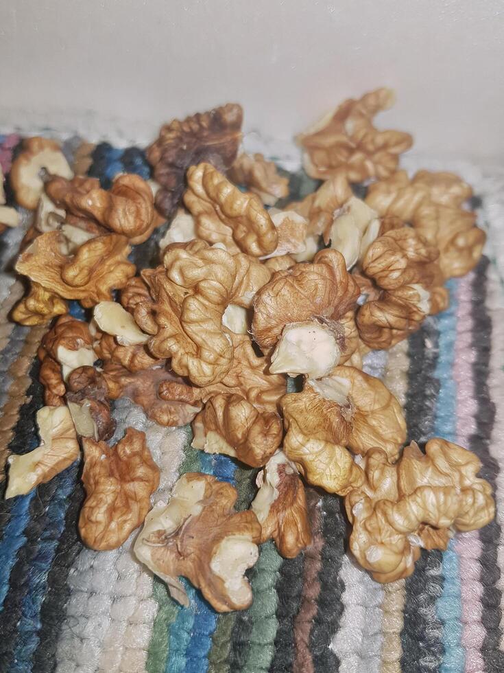 A detailed close-up of the walnut kernel reveals its interior beauty, showcasing the freshly extracted, nutrient-rich center and its unique texture. photo