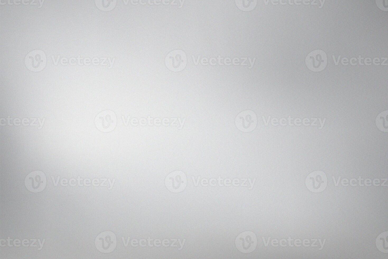 Subtle gradient of light grey with fine grain texture photo