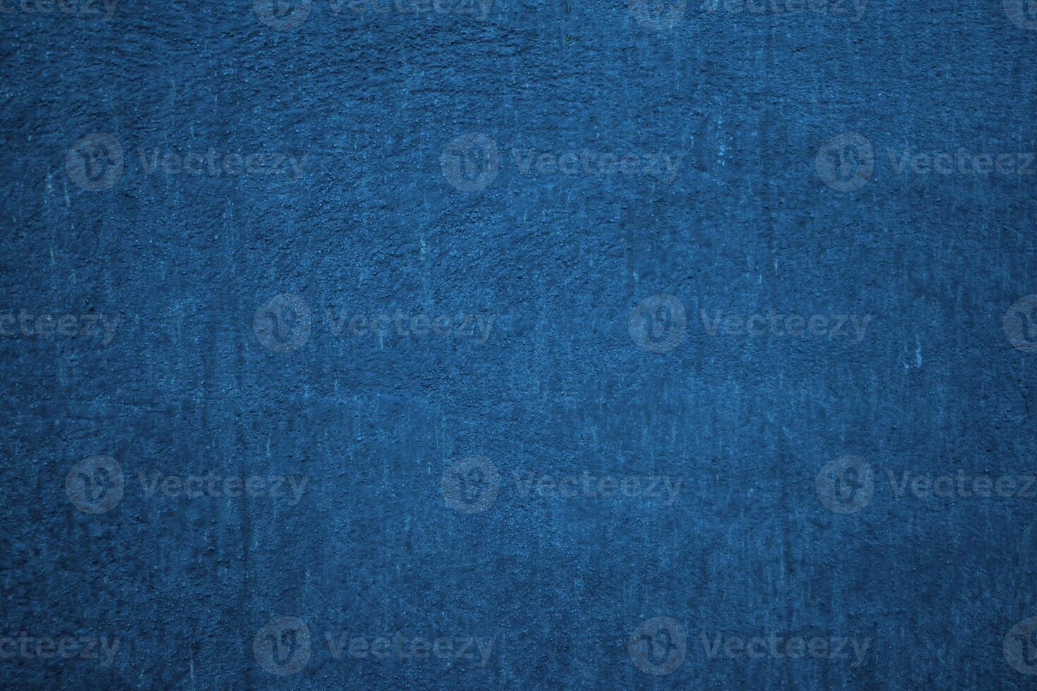 Deep blue textured background. Embossed wall with blue tones photo