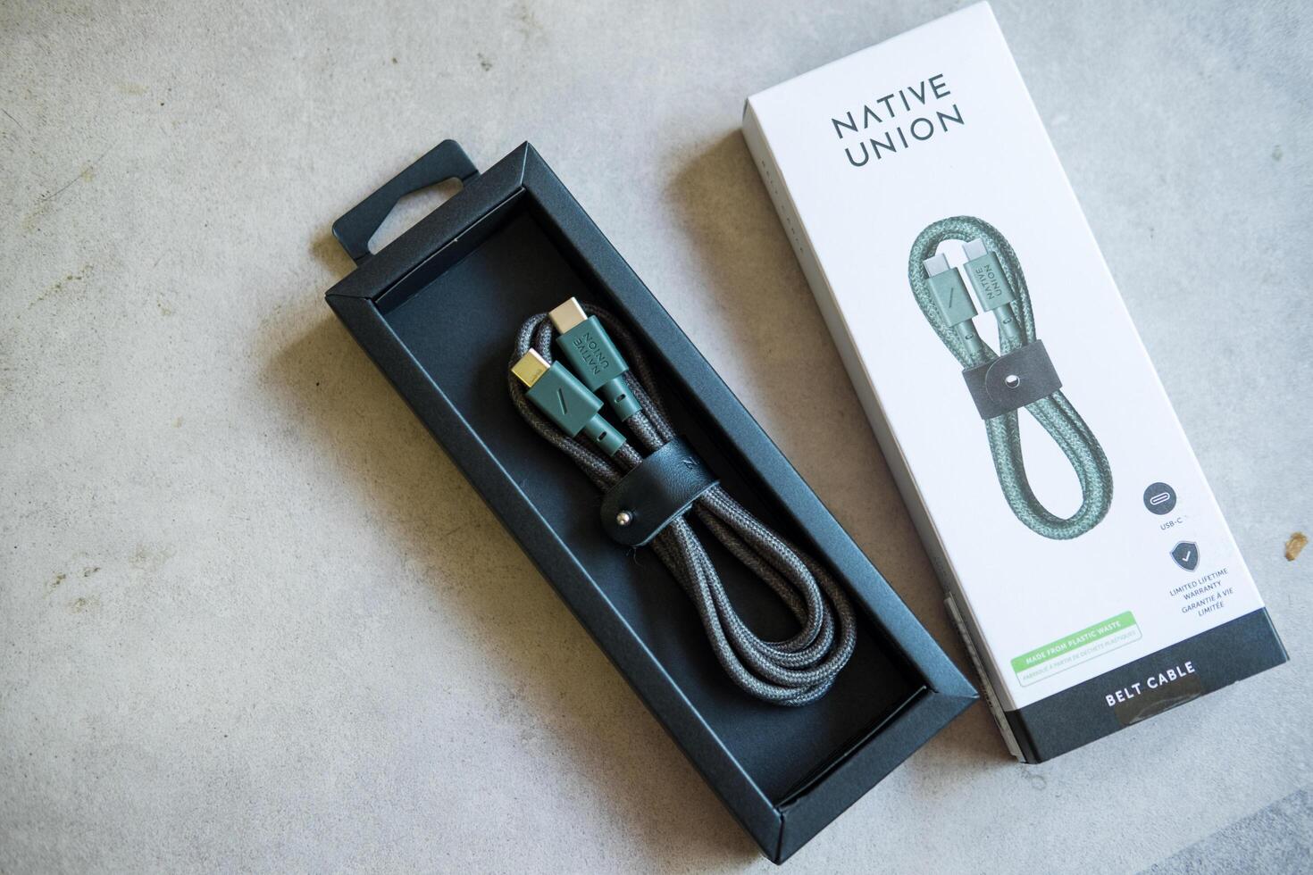 Bangkok, Thailand - July 12, 2025 Belt Cable USB-C to USB-C The recycled 4-foot charging cable with bonded leather strap photo
