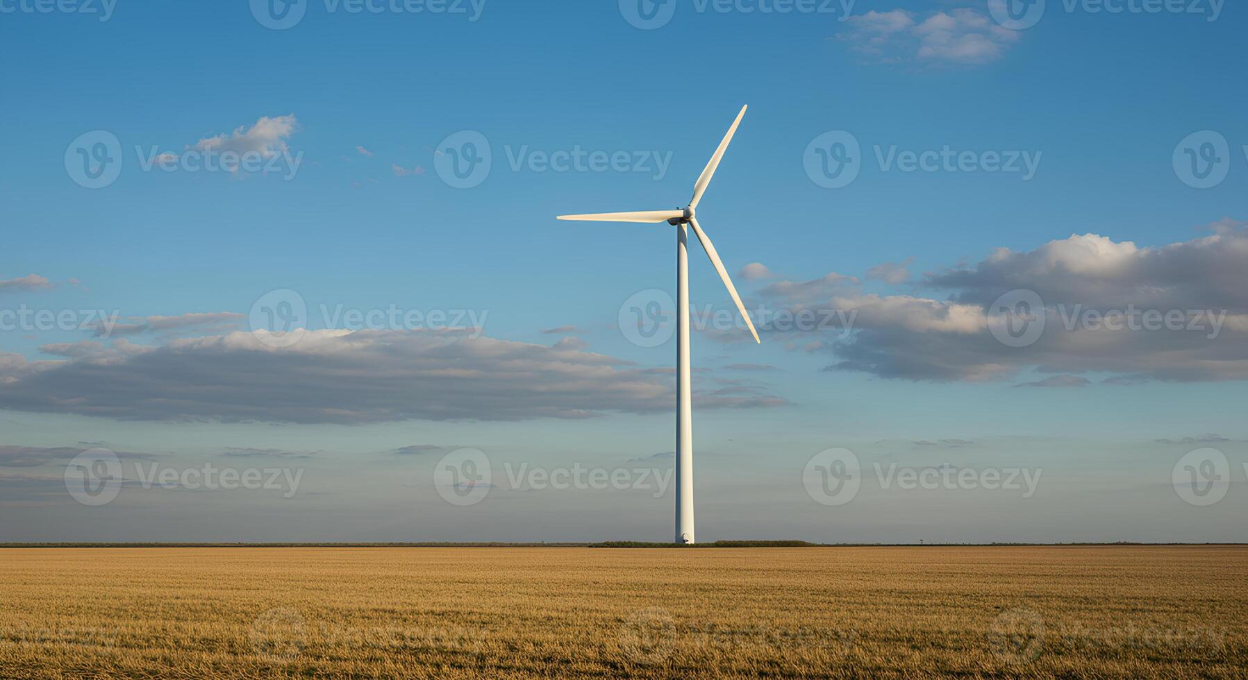 White wind turbine standing in open field for renewable energy visuals, green energy transition concepts, and environmental awareness. Wind turbine in grassy landscape symbolizing clean energy photo