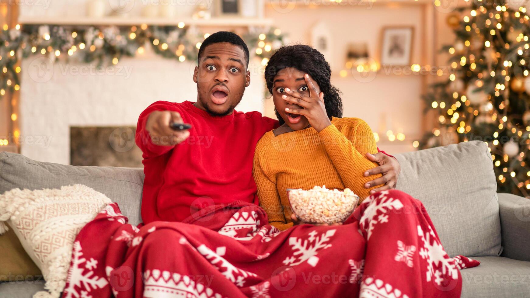 Couple watching movie with popcorn photo
