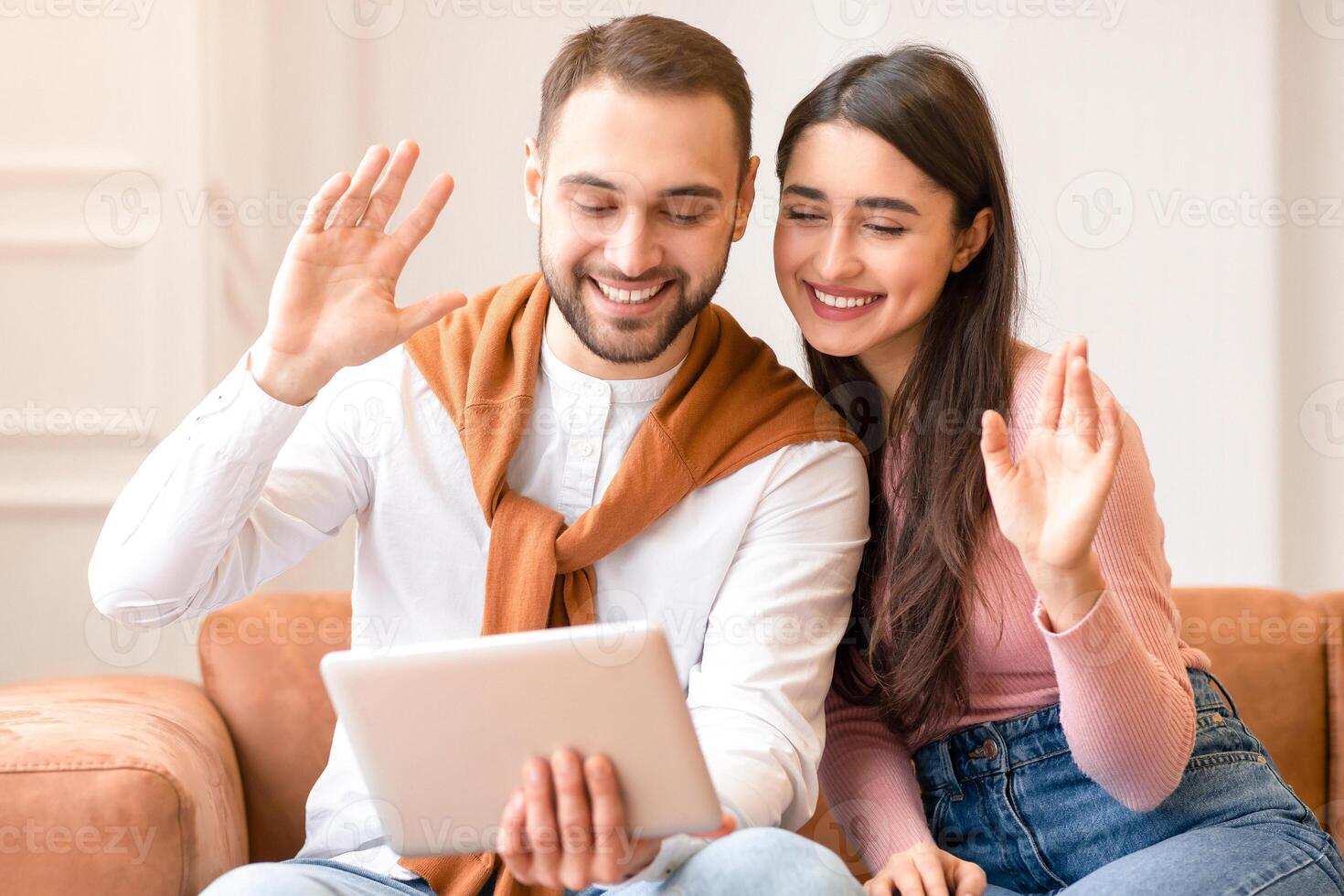 Couple video calling on a tablet photo