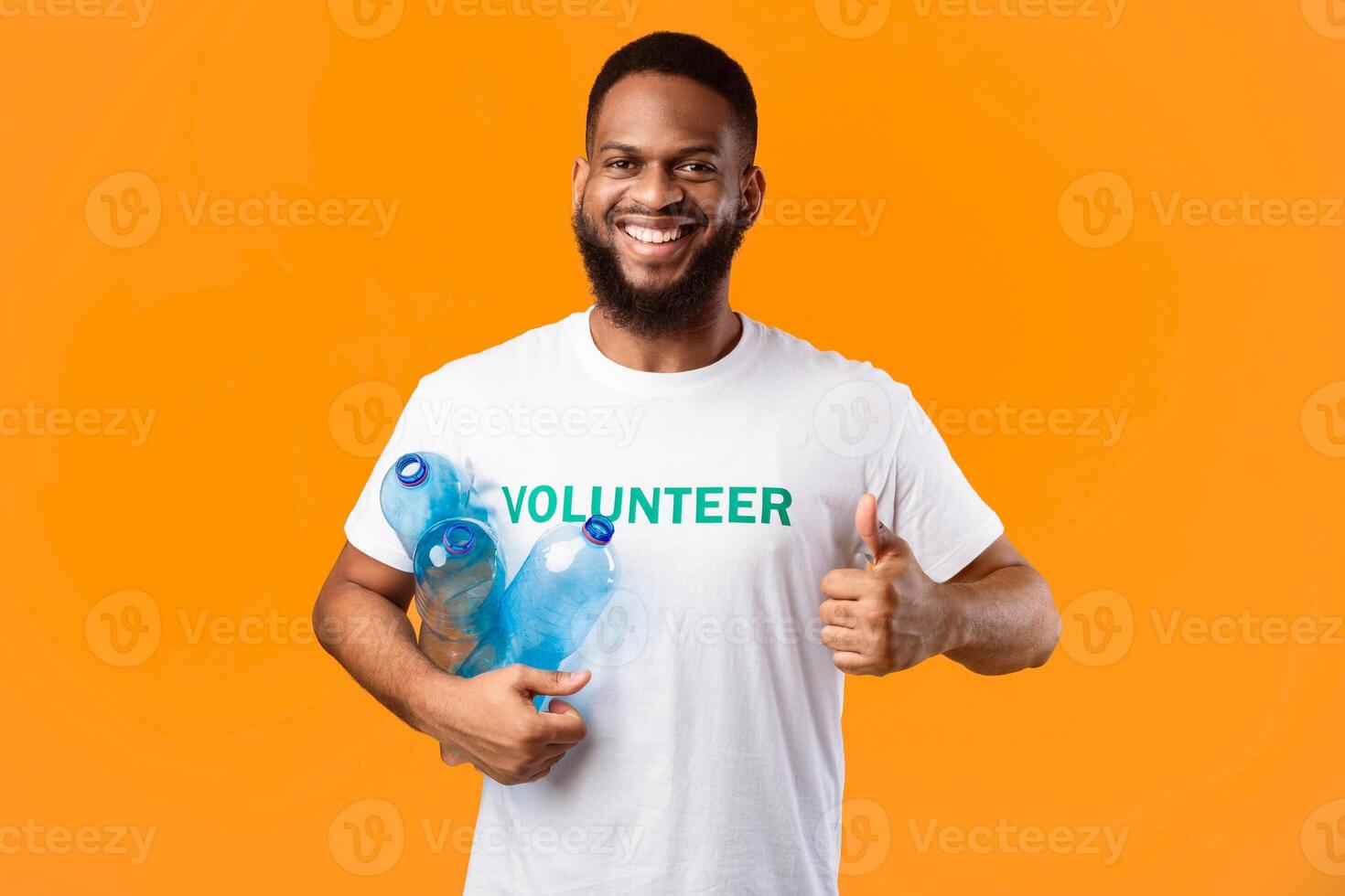 Smiling man with water bottles photo