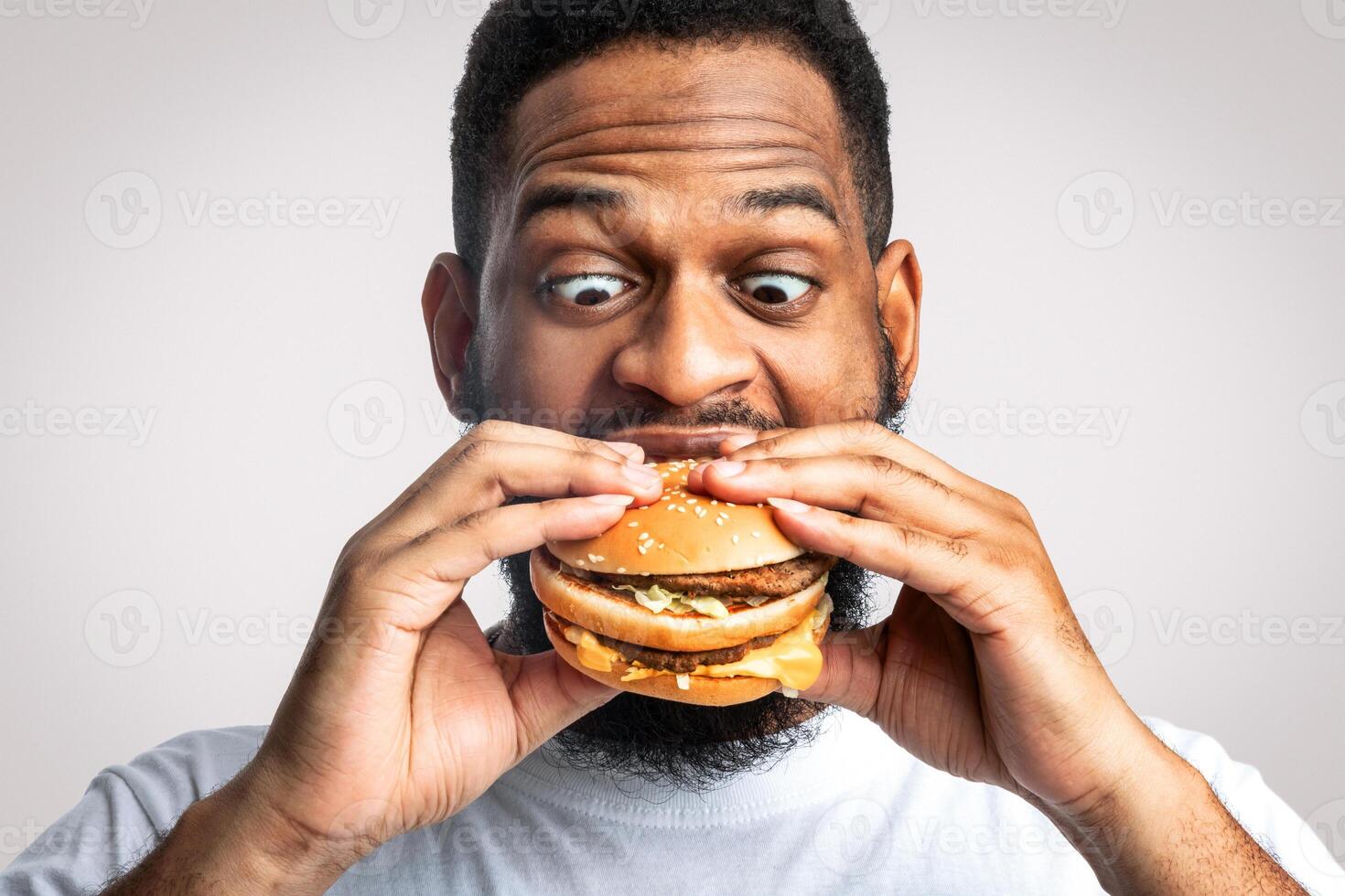 Man excited about giant hamburger photo