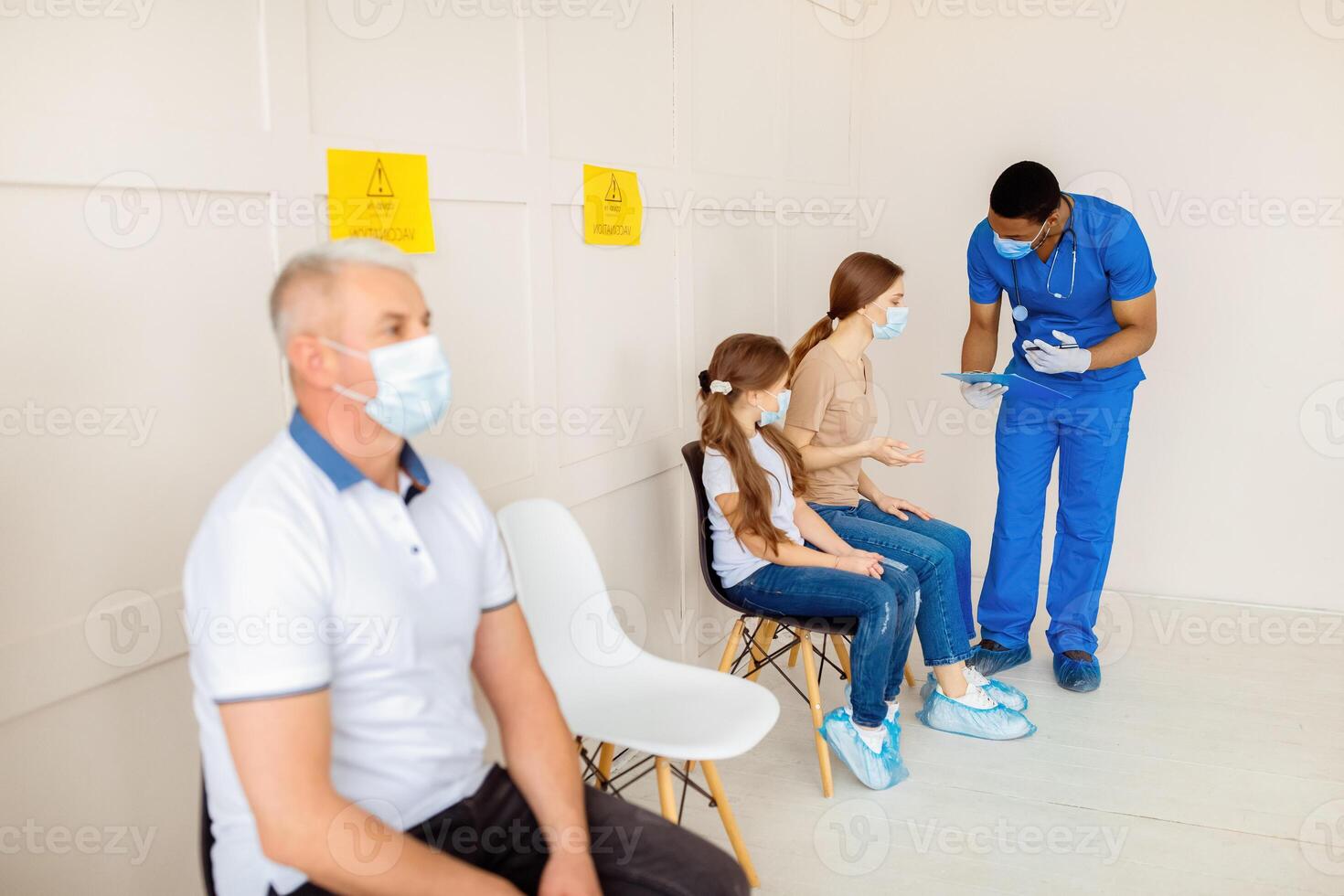 Immunization against coronavirus. Senior man in medical mask waiting for covid-19 vaccine in line at health centre, copy space. Viral disease prevention, healthcare and medicine concept photo