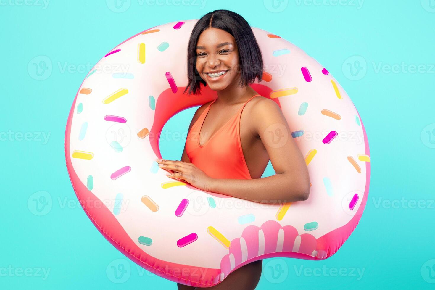 Woman with donut-shaped float photo