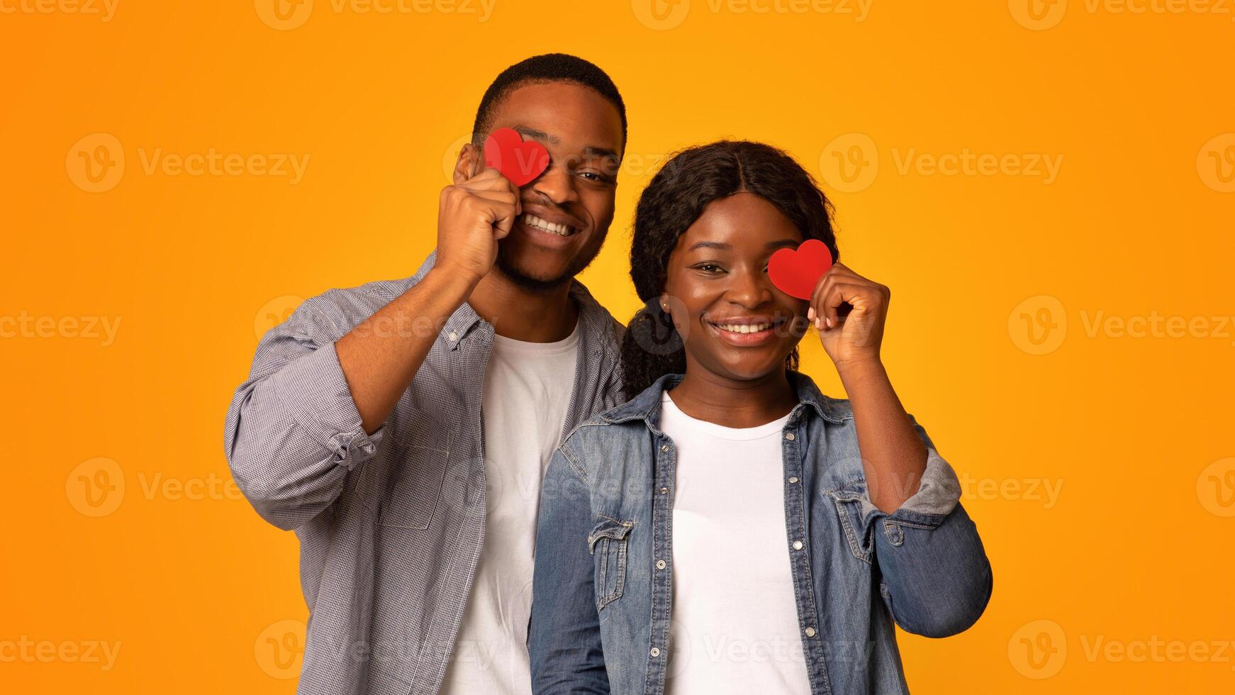 Couple with red hearts expressing love photo