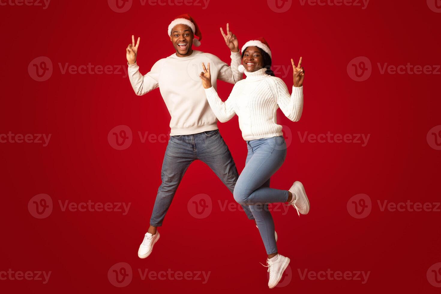 Celebrating friends in Christmas hats photo