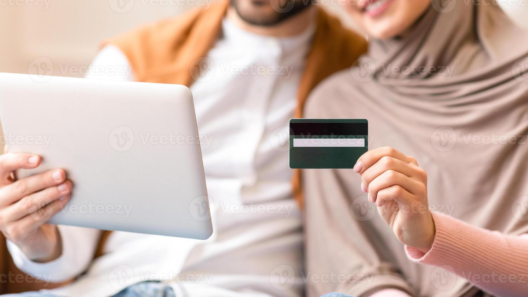 Couple using tablet for online shopping photo