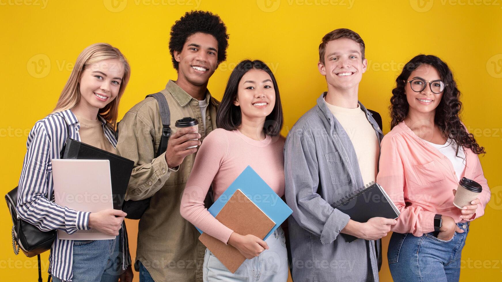Diverse students with notebooks and coffee photo