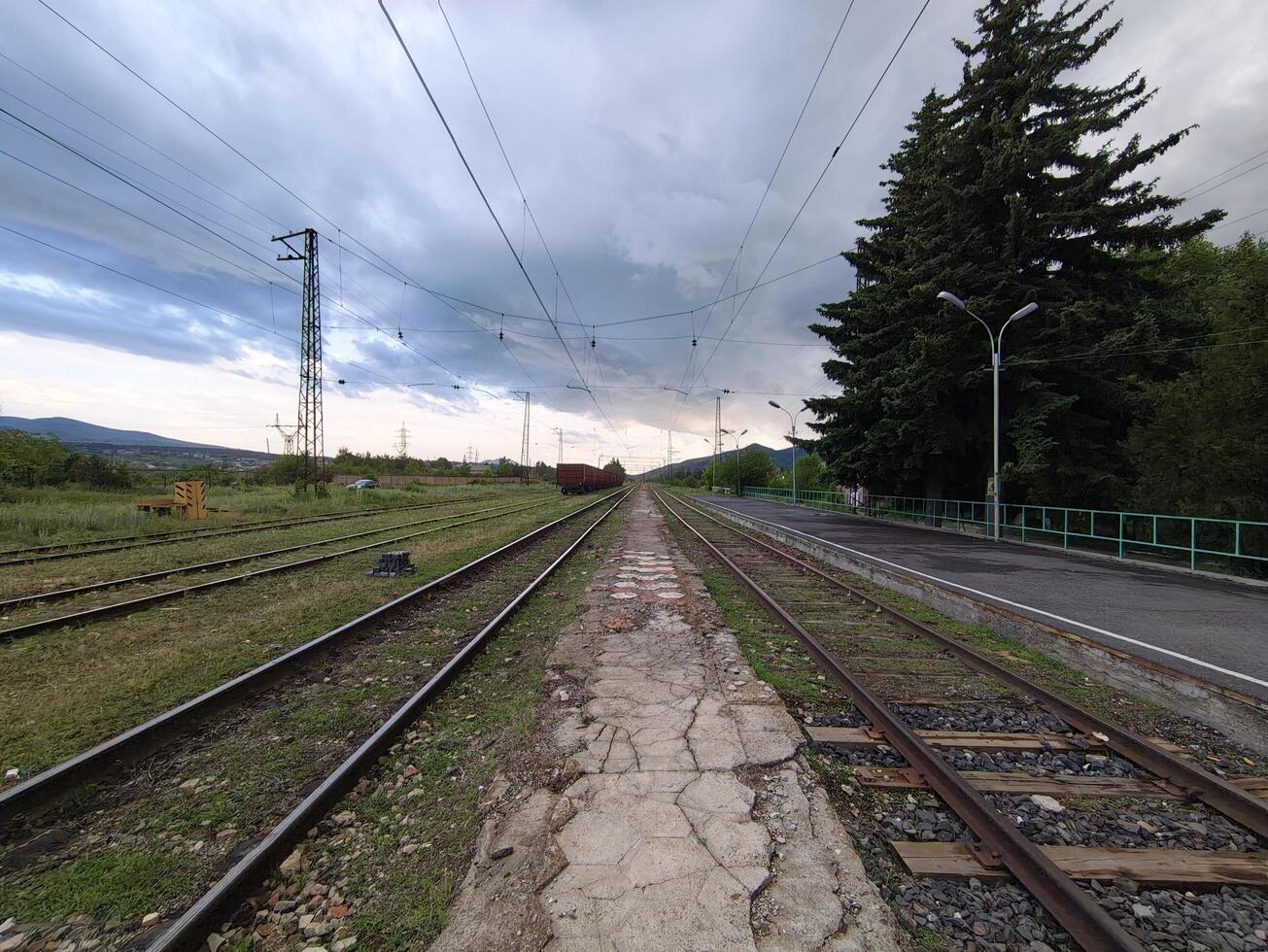 Passenger platform of the railway station photo