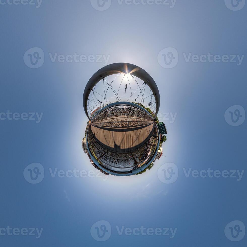 A small planet with a large building in the middle photo