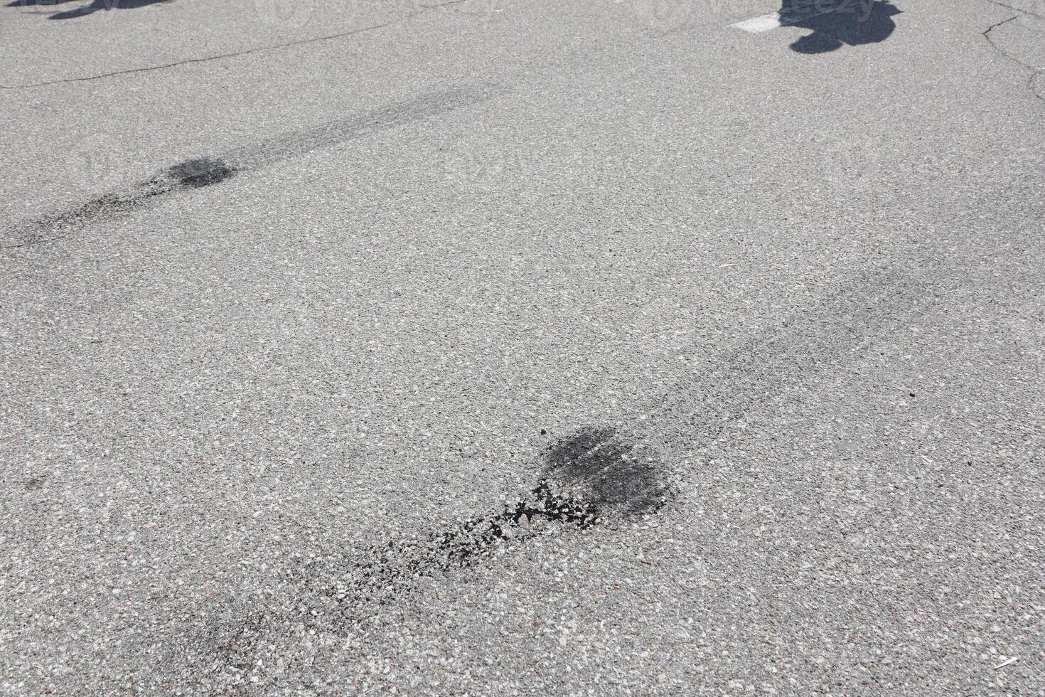 Tire Marks Left on the Asphalt Surface During Various Driving Events and Conditions photo