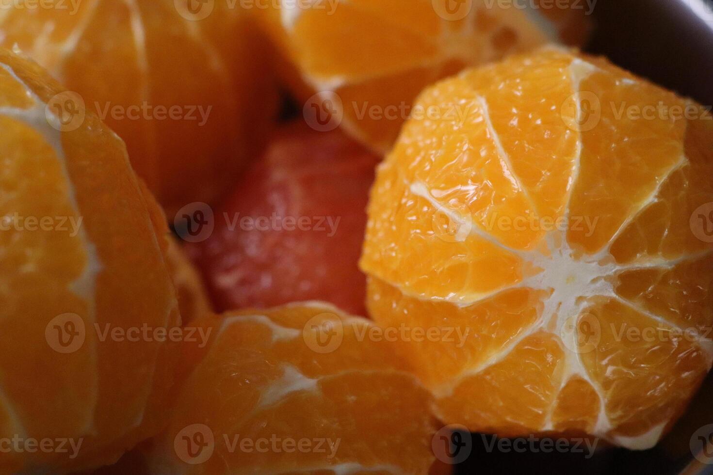 An Exquisite and Beautiful Arrangement of Fresh Citrus Fruits Displayed Elegantly in a Bowl photo