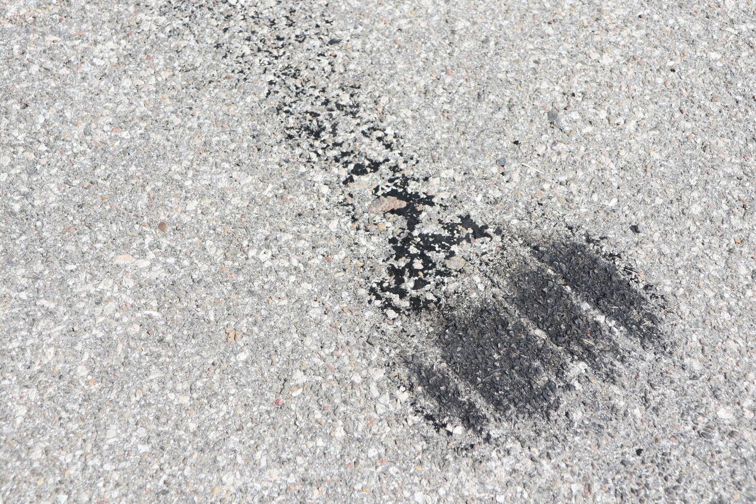 Tire Marks on an Asphalt Surface Showcasing Automotive Artistry and Landscape Details photo
