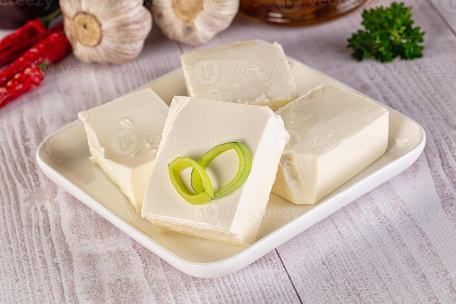 A plate with four pieces of butter and garlic photo