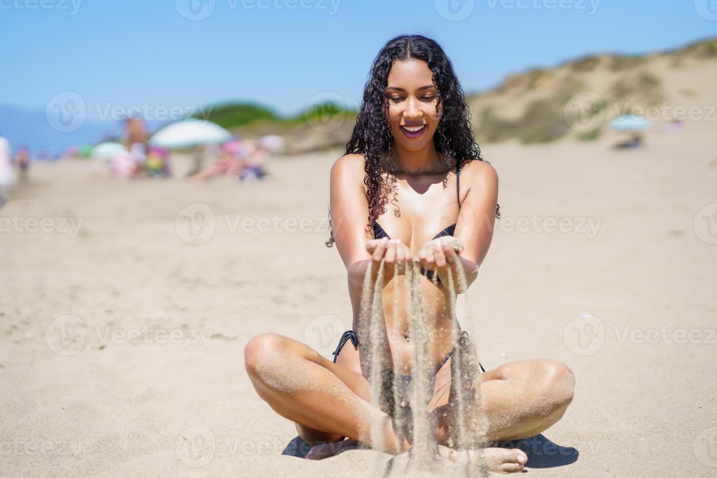 Experiencing a Joyful Moment at the Beach While Enjoying Fun with Sand Play and Relaxation photo