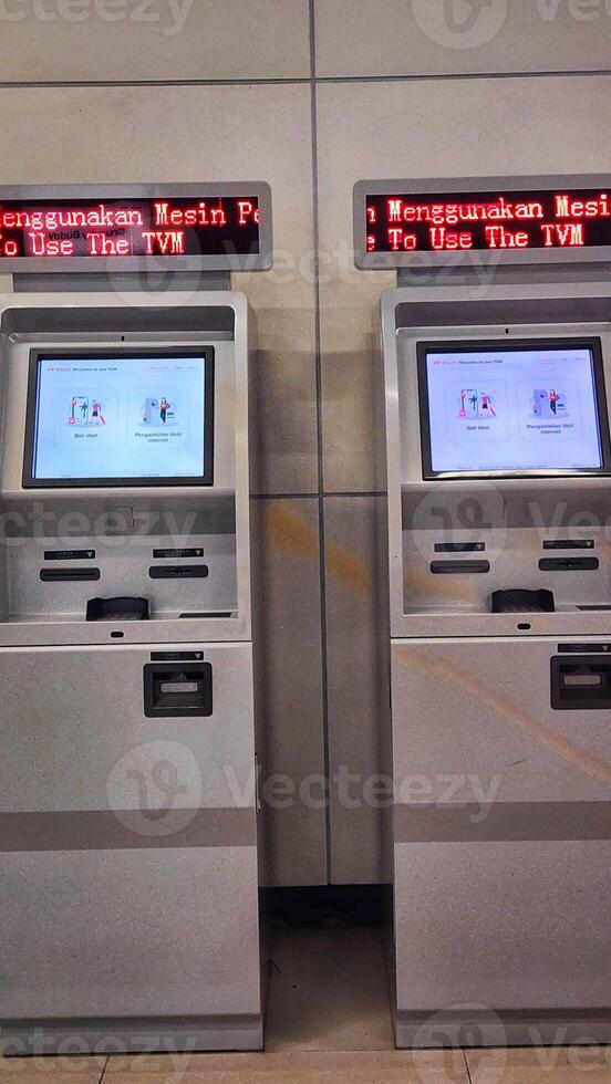 Two ticket vending machines in a metro station photo