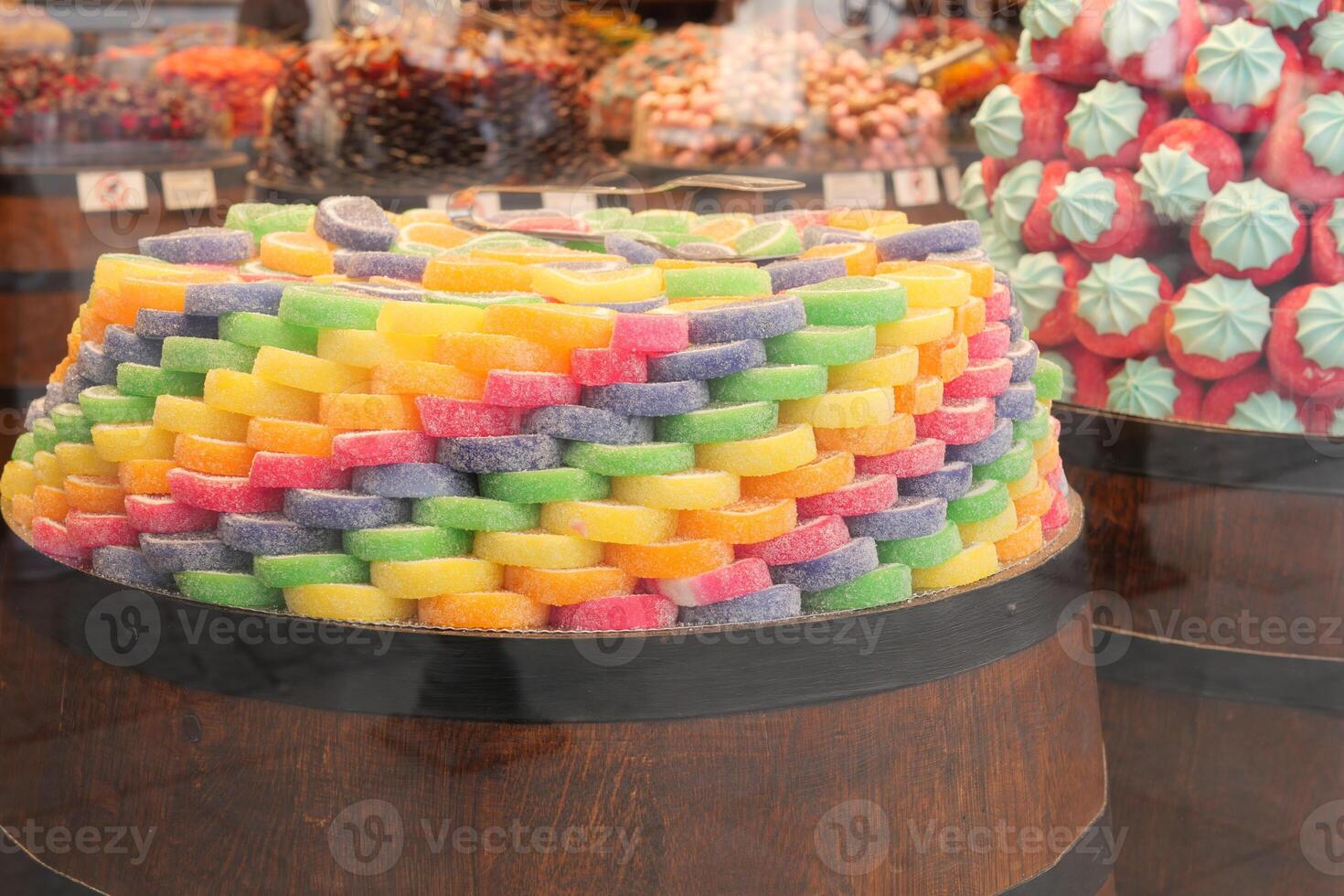 Colorful candy display in a market stall during daylight photo