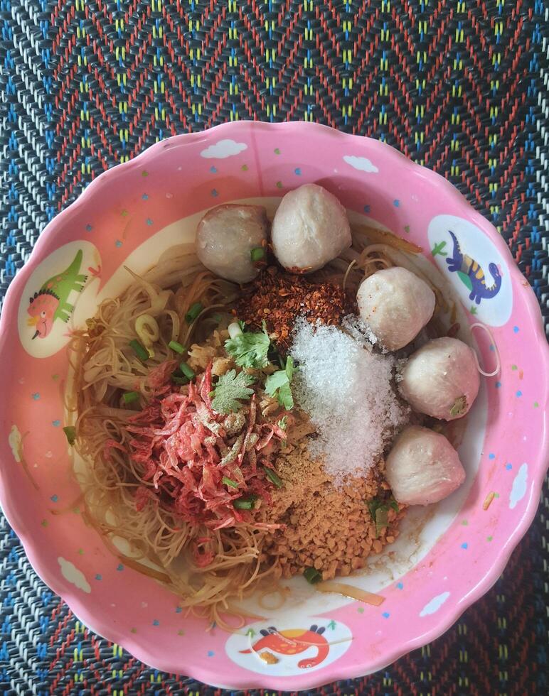 Dry noodles, a delicious Thai food that is sold on the streets of Thailand. photo