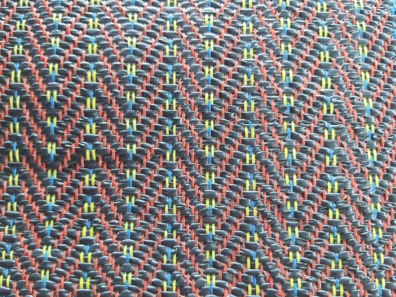 Colorful beads form an abstract, textured pattern, creating a vibrant textile design for a unique backdrop photo