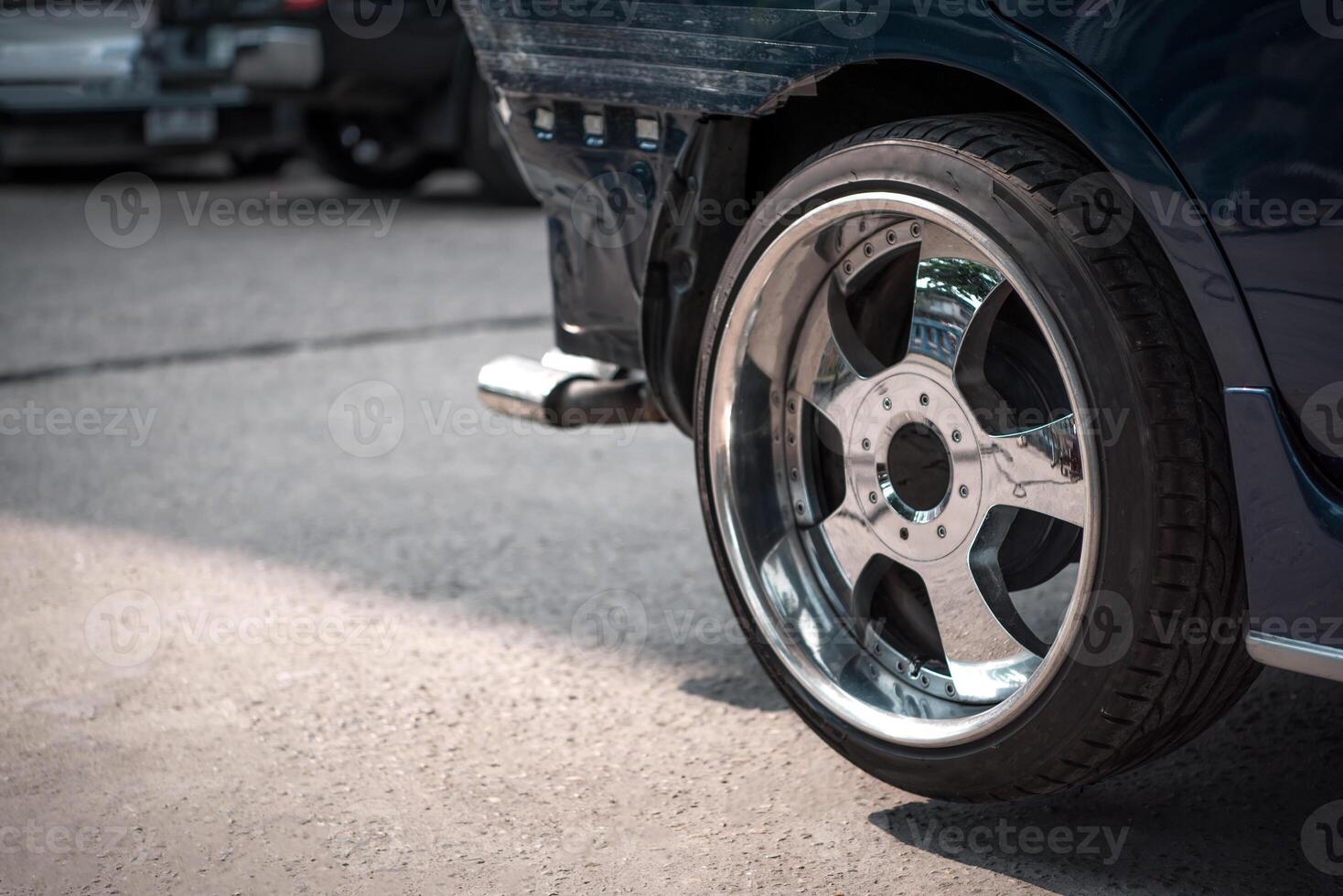 A close up of a car with a wheel photo