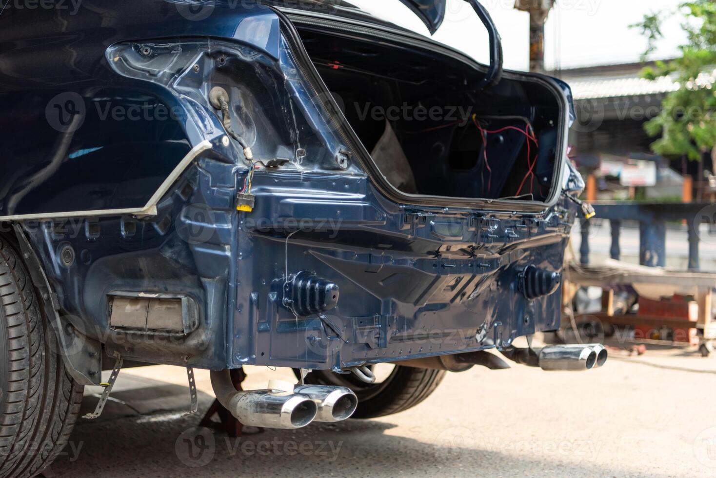 A car with its rear bumper and exhaust pipes photo